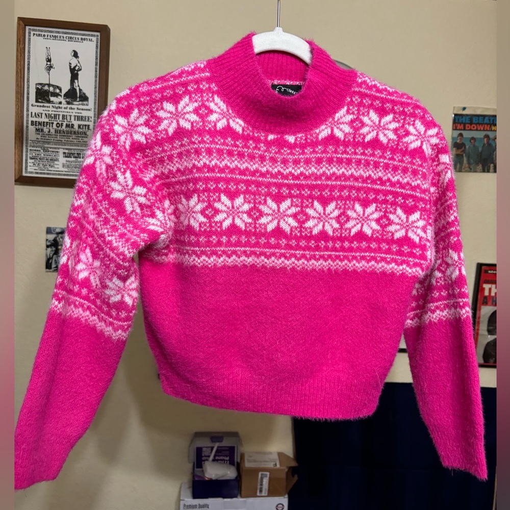Cute pink sweater.